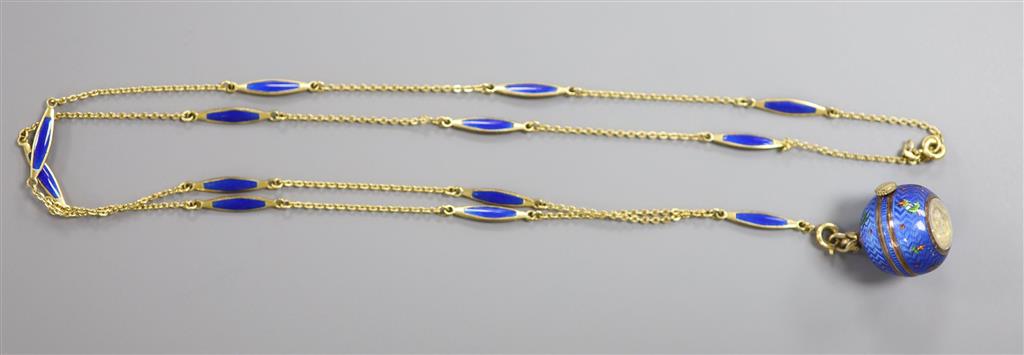 A Swiss blue enamelled and yellow metal globular fob watch on a gilt metal and enamelled chain, chain 84cm.